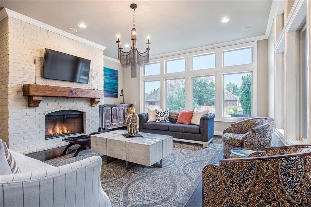A Home Manager's furnishings arranged in a staged living room with a fireplace